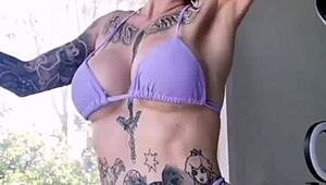 Melody Radford's huge tits and tattooed ass barely fit in micro bikini slut tease