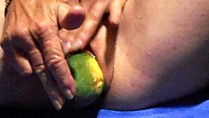 Watch her tease wet pussy with cucumber close-up for ultimate gaping clit pleasure