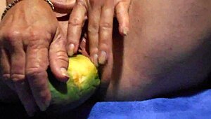 Watch her tease wet pussy with cucumber close-up for ultimate gaping clit pleasure