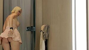 hey check out this naked blonde flashing see-through outfits in the mall changing room outdoors