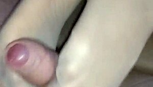 homemade girlfriend in nylons gives footjob with toes on cock ending in hot cumshot
