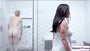 hey milf's fingers deep in her gf's stepdaughter's shaved pussy during steamy lesbian shower fingering and licking session