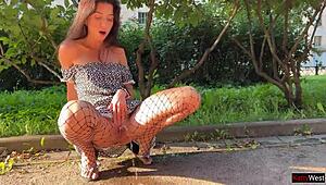 skinny brunette flashes upskirt ass plug pee in public fishnet pantyhose on street