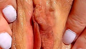 Watch this mature cougar spread shaved pussy for close-up yoni massage fingers deep!