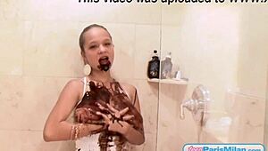 Chocolate drips off 18+ teen Paris Milan's big tits in steamy shower striptease!