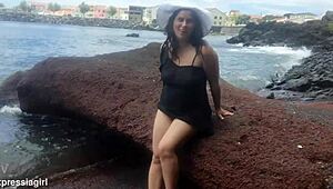 Curvy brunette flashes pussy and masturbates publicly on beach