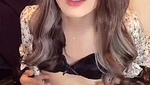 Japanese ladyboy in dress strokes her cock quietly before craving deep anal pounding