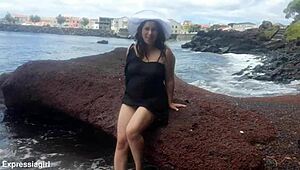 Curvy brunette flashes pussy and masturbates publicly on beach