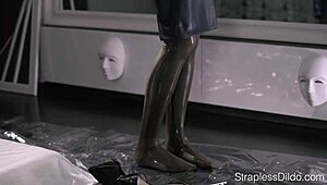 Oiled latex catsuit office lady Maria Pie straps on dildo and cums hard at work