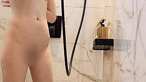 Black hair japanese college girl bathes skinny body in shower