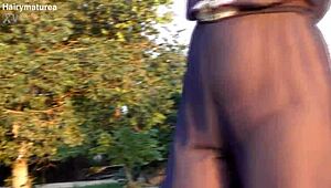 hairy mature flashes beaver through see-thru outfit outdoor