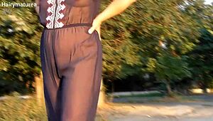 hairy mature flashes beaver through see-thru outfit outdoor