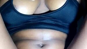 Lady massages her beautiful black tits so seductively