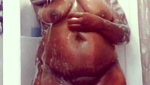 Chubby ebony wife teases wet curves in motel shower preview