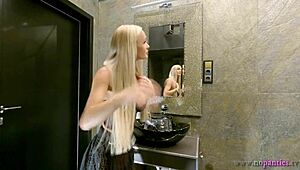 Curious blonde's big tits peek through see-through miniskirt sans panties.