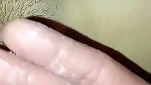 Detailed fingering teases wet pussy close-up