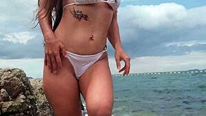 Petite babe chills in tropical bikini on sunny beach vibes