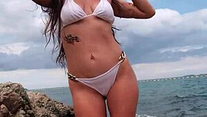 Petite babe chills in tropical bikini on sunny beach vibes