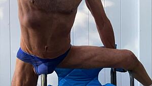 deep pelvic stretching in blue briefs on blue chair late october 2024
