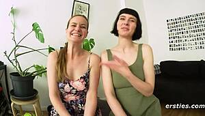 Two sexy German brunettes suck tits and kiss passionately in public hallway