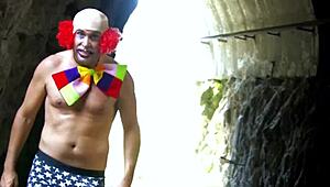 A busty young wife bends over for the clown's rough cock pounding her big ass doggystyle then takes it deep in her shaved pussy