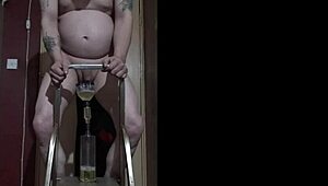 Bisexual dude naked on ladder pisses in bottle and drinks it all!