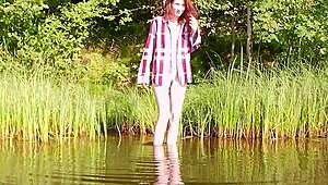 Petite Cute Redhead Beauty Goes Nude Outdoor by Lake Flashing Natural Tits Publicly