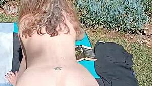 mature blonde cougar spreads huge shaved pussy lips in secret outdoor garden flashing