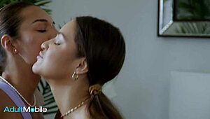 Sweaty Lesbians Pleasure Each Other on Bed with Intense Moans