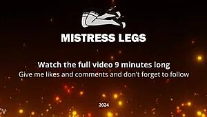 Mistress's nyloned toes tease seductively close-up on desk