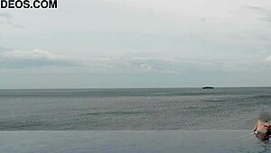 skinny japanese college girl in ponytail dips into infinity pool showing off legs and small waist