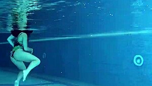 Diana Rius's juicy latina tits glisten as she gropes underwater in bikini