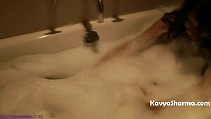 horny indian housewife fingers her big tits and ass in the steamy shower bath