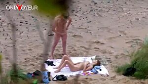 damn i caught this teen couple on the beach fingering each other passionately naked voyeur style
