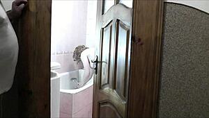 sexy blonde strips naked in bathroom as roommate jerks off watching her wet folds