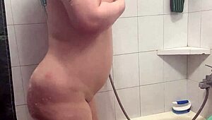 Chubby Tattooed Babe Teases Wet Pussy in Shower!