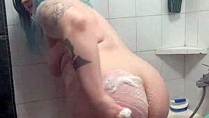 Chubby Tattooed Babe Teases Wet Pussy in Shower!