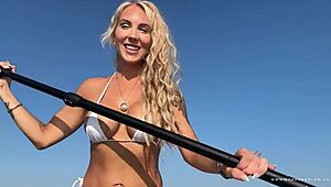 Whoa, lush blonde MILF does wet yoga in bikini on water then takes public cumshot!