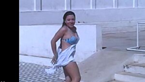 Hey, you watching me film my sexy Brazilian friend rip her clothes off in this steamy striptease? Check my blog for way more hot lesbian action like this