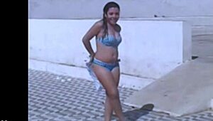 Hey, you watching me film my sexy Brazilian friend rip her clothes off in this steamy striptease? Check my blog for way more hot lesbian action like this