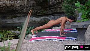 Watch naked milf yoga instructor Daniella Smith stretch trimmed pussy outdoors