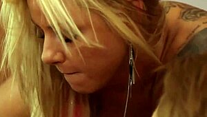tattooed milf fingers and licks brunette pussy orally in bed