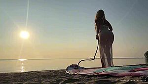 Whoa, lush blonde MILF does wet yoga in bikini on water then takes public cumshot!