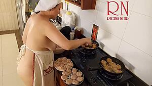 Nudist housewife Regina Noir prepares meals bare in kitchen as naked maid beach vibe