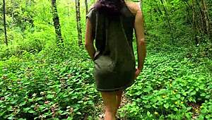 Beautiful european brunette babe strips naked showing perfect ass walking through woods outdoors
