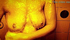 sexy milf shakes wet tits nipples hard in slow mo shower