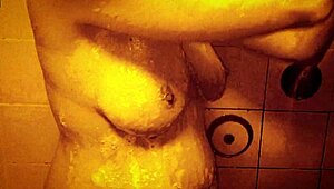 sexy milf shakes wet tits nipples hard in slow mo shower