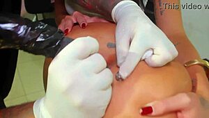 whoa tattooing that whore's tight ass hole while the artist inks her gaping anus 😈🔥