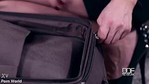 submissive brunette babe crammed into suitcase as hand luggage for kinky storage