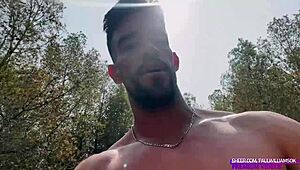 muscular guy strokes monster cock naked in forest public flash